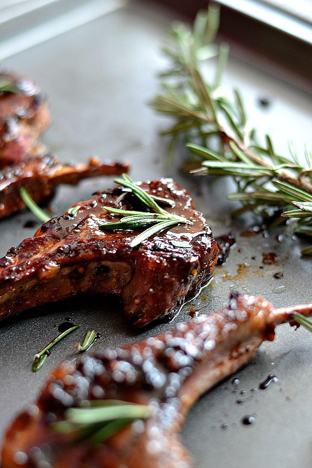 grilled meat with herbs and seasoning on a baking sheet