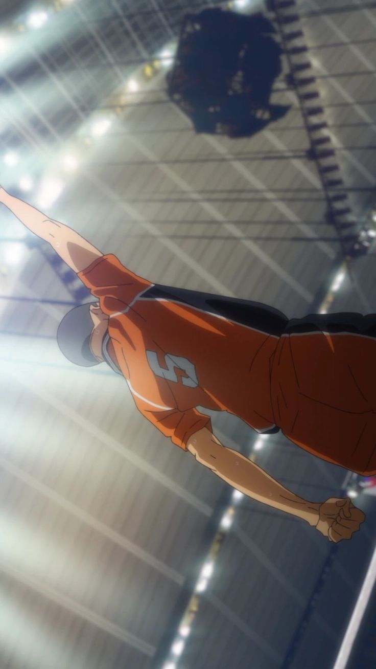 a man flying through the air while wearing an orange shirt