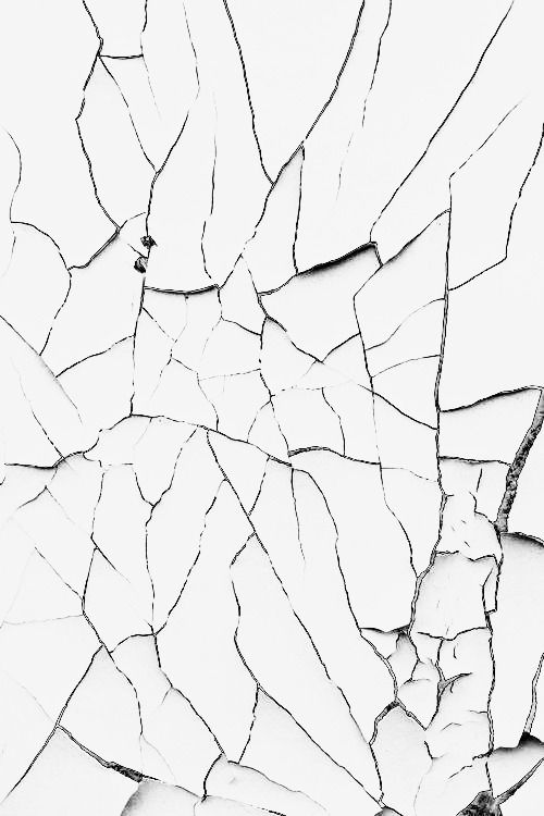 a cracked white surface with cracks in it