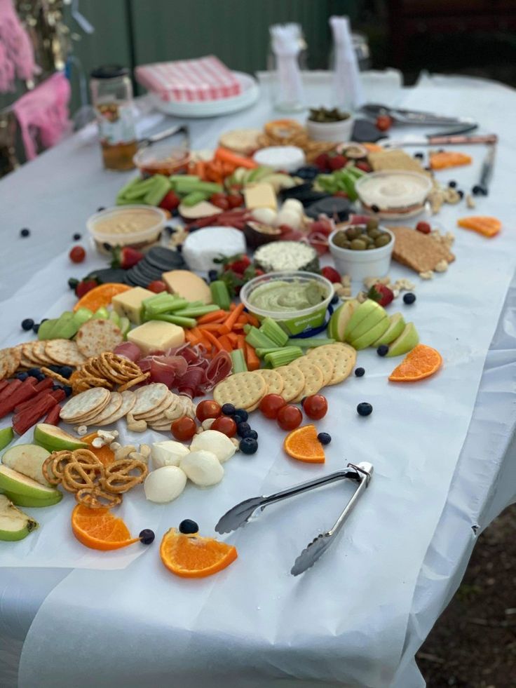 a long table covered with food and utensils