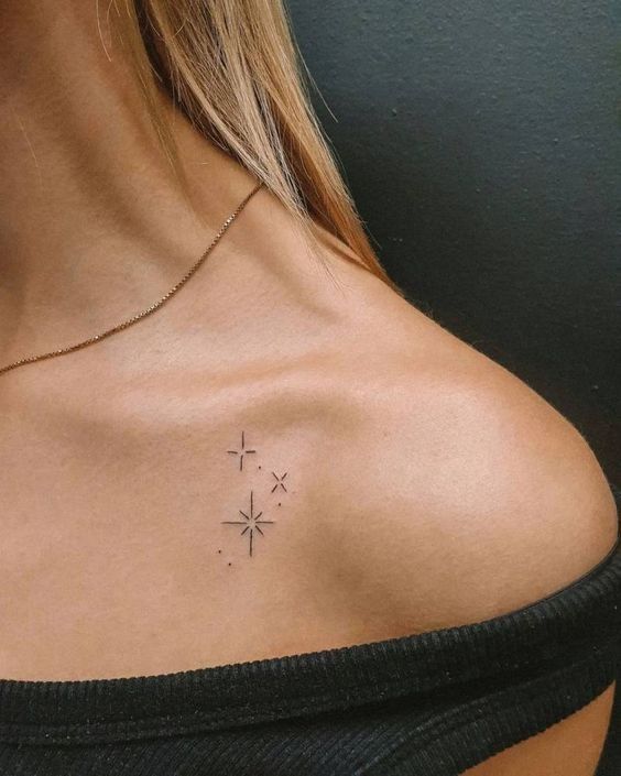 a woman with a small tattoo on her chest