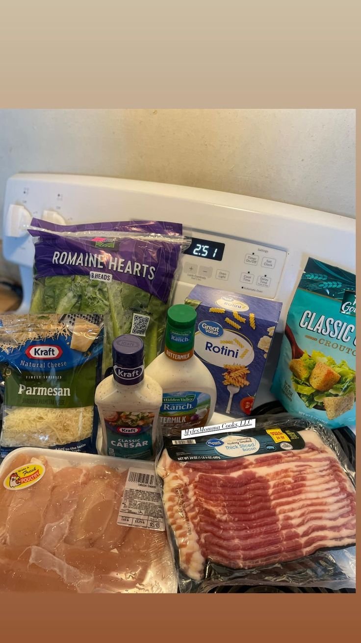 the ingredients for this meal are laid out on top of an open refrigerator door and ready to be put into the freezer