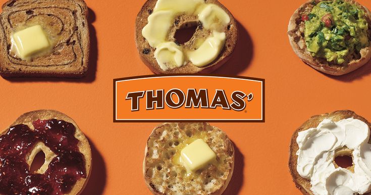 there are many different types of breads on this orange surface with the words thomas