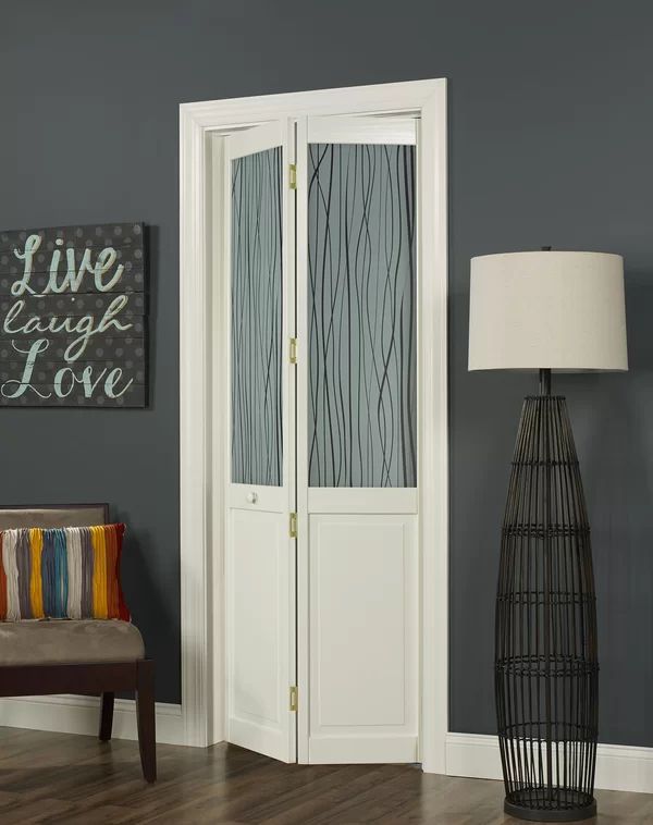 a living room with gray walls and white doors