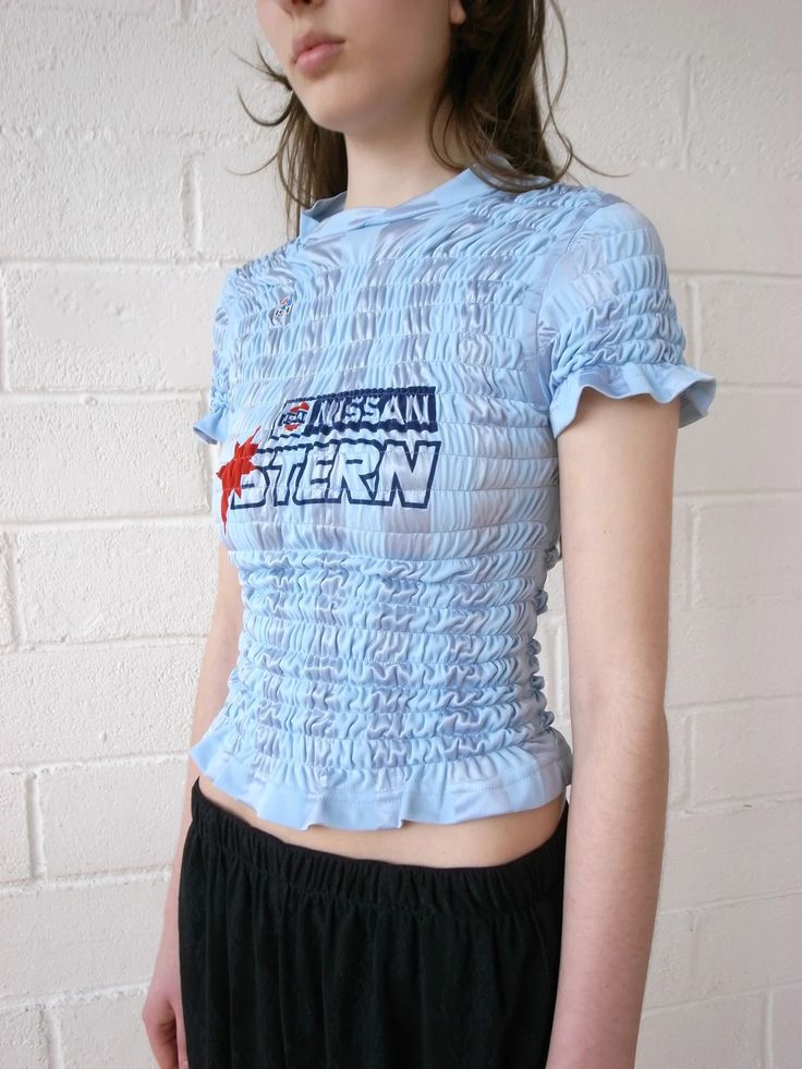 The Reconstituted Shirred Football Top Football Top, Jerseys Football, Upcycle Ideas, Football Fashion, Football Tops, Girl Code, Elastic Thread, Upcycled Fashion, Clothes Rack