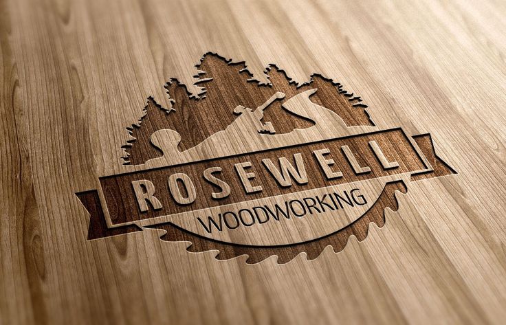 the logo for rosewell woodworking is engraved on a wooden surface with pine trees in the background