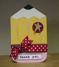 a thank you card with a red bow and white polka dot ribbon on the front