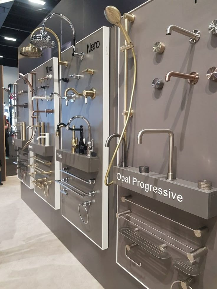 an industrial sink and faucets on display in a showroom