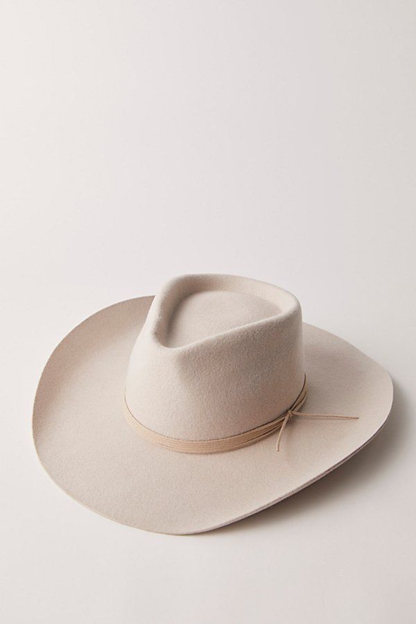 A classic cowboy hat featured in a soft wool felt fabrication and structured silhouette with an upturned brim and teardrop crown. **Features:** Soft wool felt fabrication, structured design, upturned brim, teardrop crown, classic cowboy silhouette **Why We ❤ It:** This effortlessly cool cowboy hat adds the perfect western-inspired touch to every outfit. | Walk The Line Cowboy Hat by Wyeth at Free People in White Womens Western Hat, Curved Brim Felt Hat For Rodeo, Kentucky Derby Ranch Felt Hat With Curved Brim, Rodeo Felt Hat With Curved Brim, Country Style Felt Hat With Curved Brim, Bone Hat, Fitted Felt Hat For Rodeo, Rigid Flat Brim Felt Hat For Country Events, Flat Brim Fur Felt Hat For Country Events