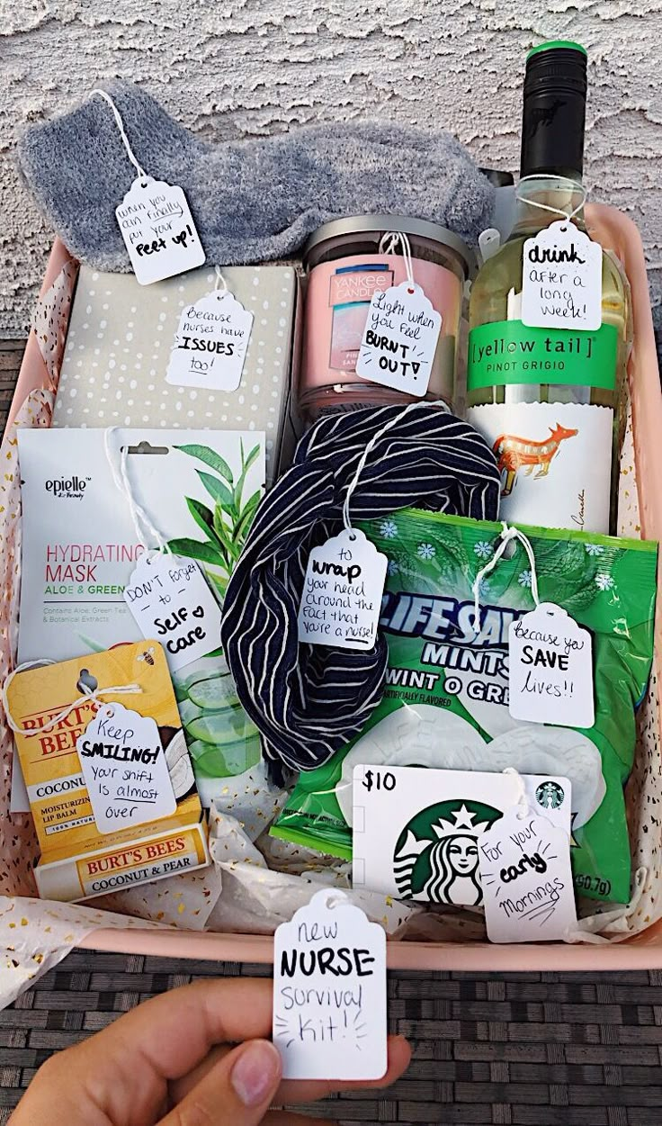 a person holding up a basket filled with items from starbucks's coffee and body care products