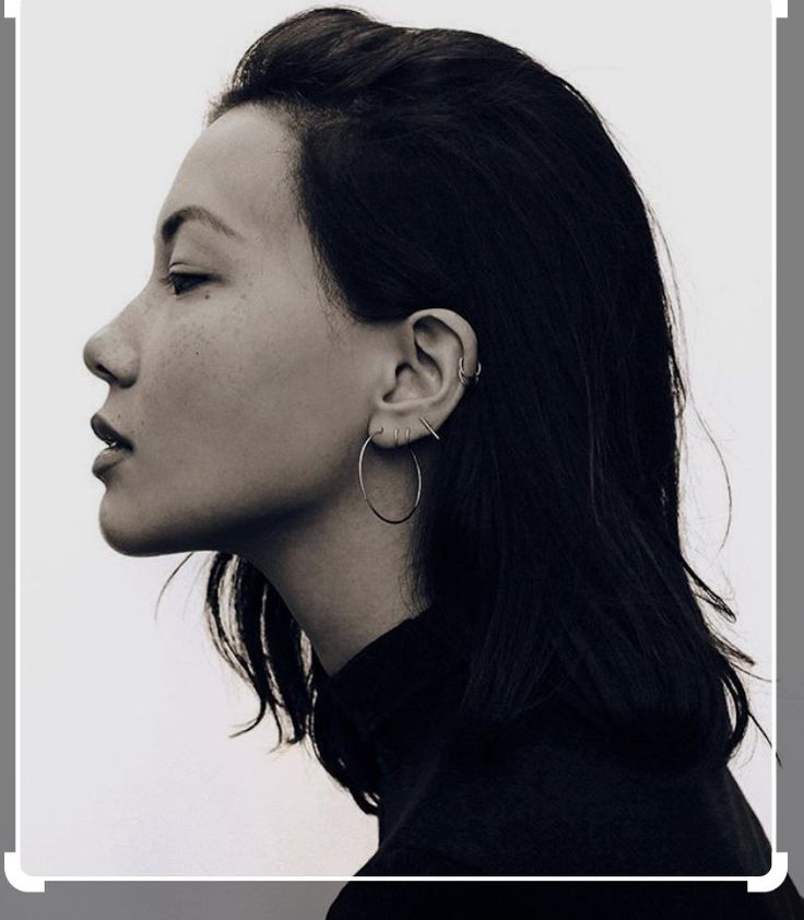 a black and white photo of a woman's profile with her eyes closed to the side