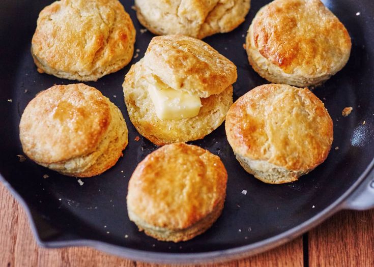 some biscuits are cooking in a pan on the table