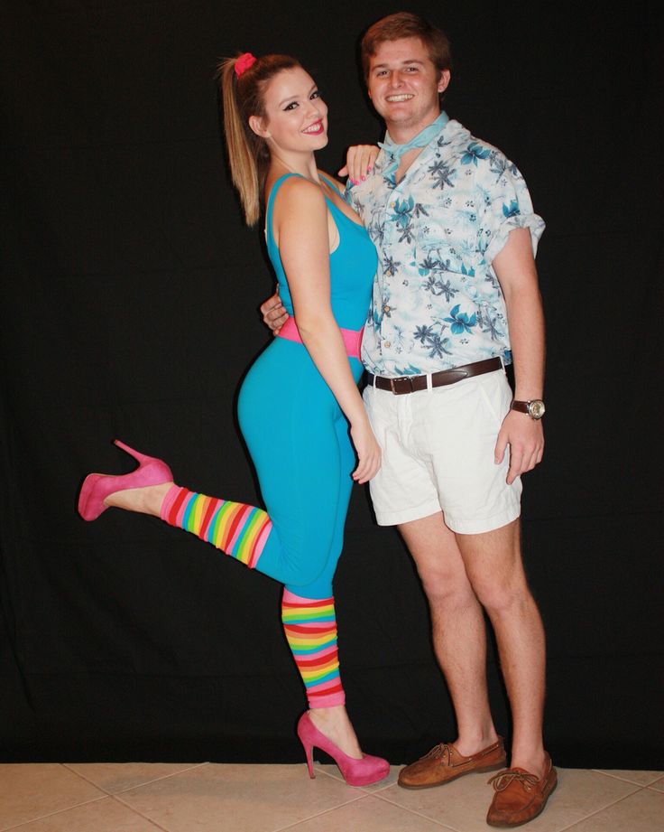 a man standing next to a woman in tights and socks, posing for a photo