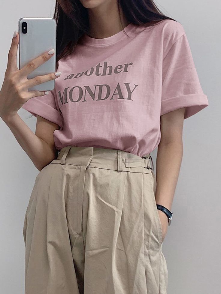 a woman is taking a selfie with her cell phone while wearing a t - shirt that says another monday