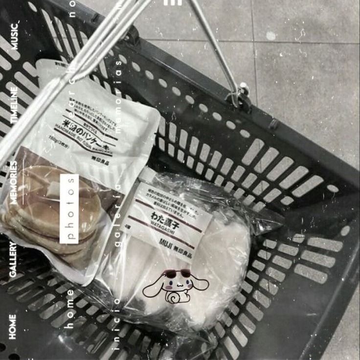 an empty shopping basket with some food in it