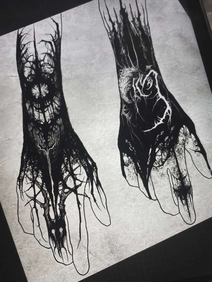 two black and white drawings of hands with trees on them