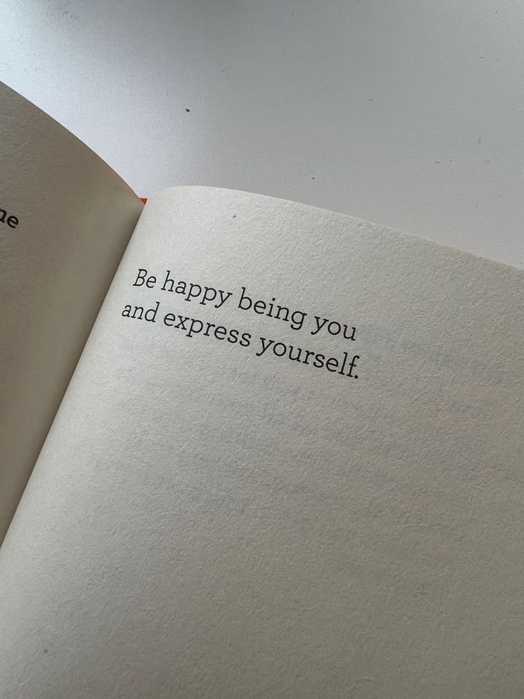 an open book with the words be happy being you and express yourself