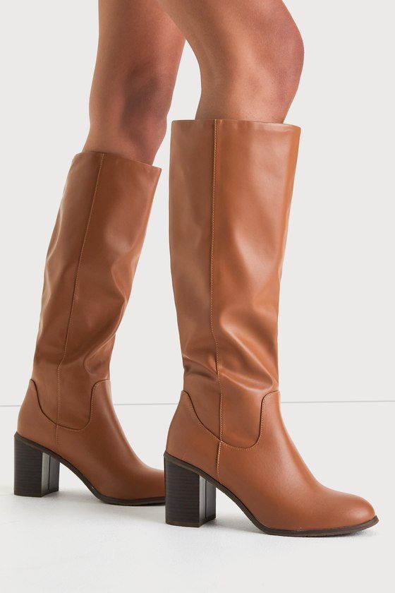 It's easy to create the perfect fall 'fit when you have the BC Footwear Back To Life Cognac Vegan Leather Knee-High Boots! Super smooth vegan leather shapes these perfect fall boots with an almond toe upper and a seamed vamp that rises to a 14"" knee-high shaft with a 14.5"" circumference. The slouchy, pull-on design sits atop a stacked, wood-look block heel. 3" stacked wood-look block heel. Cushioned insole. Rubber sole has nonskid markings. Man made materials. Imported. Lulus | Back To Life Co Tan Knee High Boots, Brown Boots Outfit, Light Brown Boots, Cognac Boots, Fall Boots, Fall Fit, High Heel Boots Knee, Lulu Fashion, Fashion Capsule