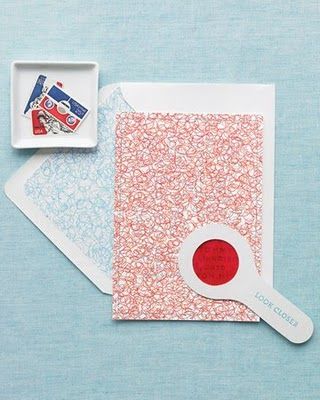 a paper craft with a red circle on it and a white square in the middle