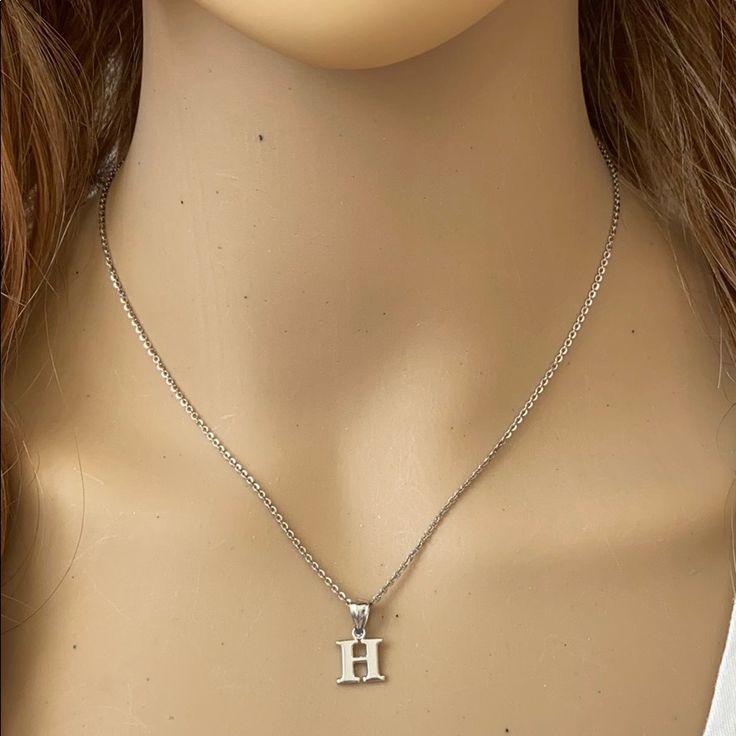 Description: 925 Sterling Silver Mini Small Initial Letter H Pendant Necklace Item No.: H89.Q Metal Type: 925 Sterling Silver (Available In 10k And 14k Gold) Metal Color: Silver Height With Bale: 15 Mm Width: 4.8 Mm Italian Rolo Chain In 16", 18", 20", Available In Another Listings In Any Letter A-Z H Initial Necklace, Letter H Necklace, H Necklace, Couple Ring Design, Shark Tooth Pendant, Initial Necklace Silver, Cross Necklace Sideways, Shine Jewelry, North Star Necklace