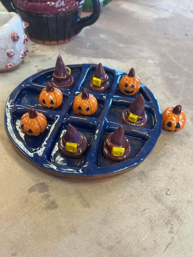 a blue plate topped with halloween treats on top of a table