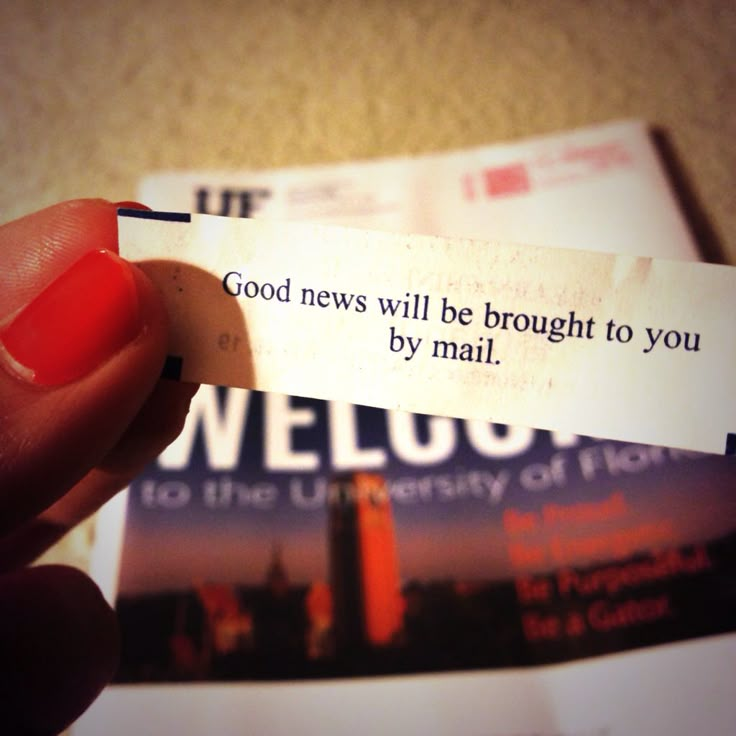 a person holding up a piece of paper with a message on it that reads, good news will be brought to you by mail