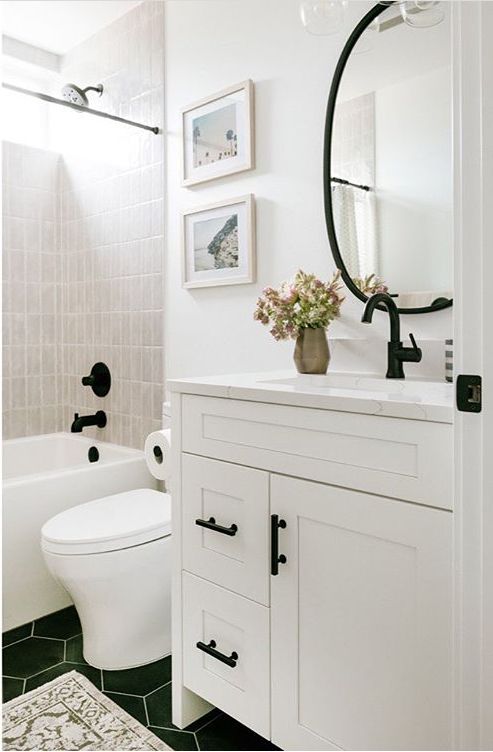 a bathroom with a sink, toilet and bathtub