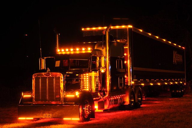 a large semi truck with lights on it's sides