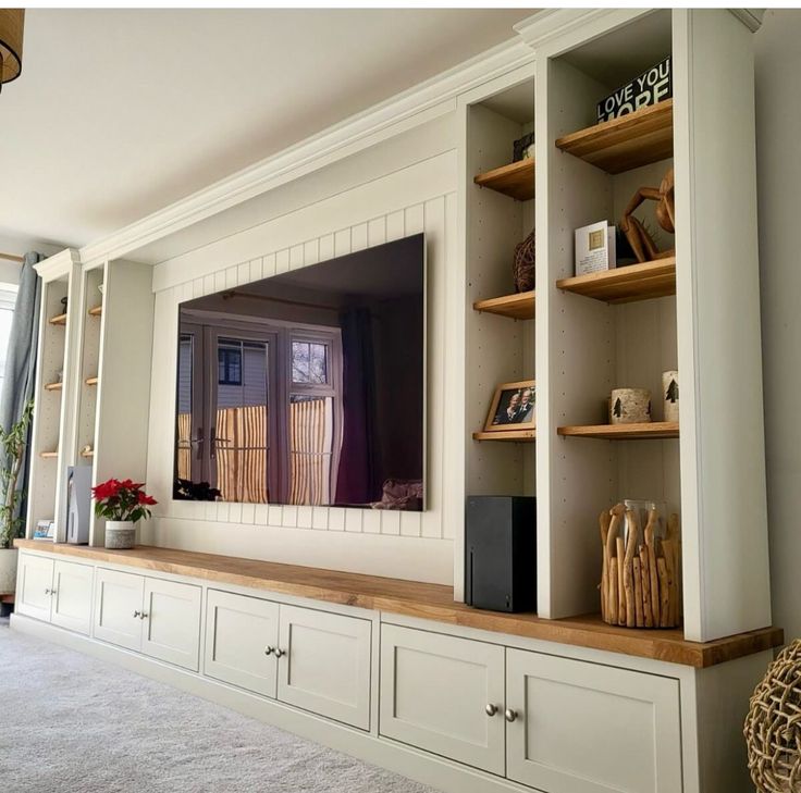 an entertainment center with built - in shelving and shelves