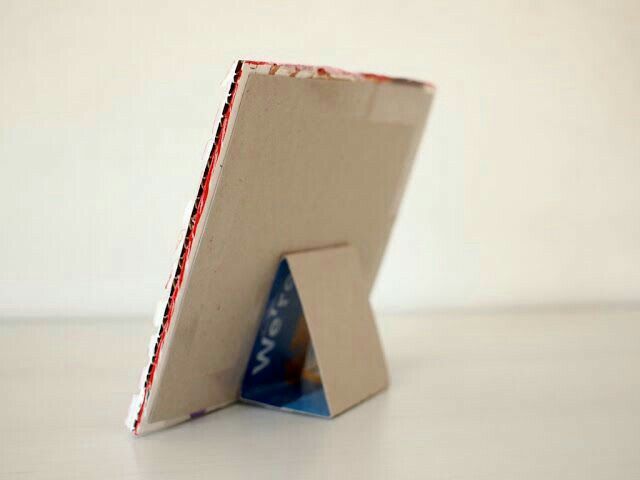 an open cardboard box with a piece of paper sticking out of it