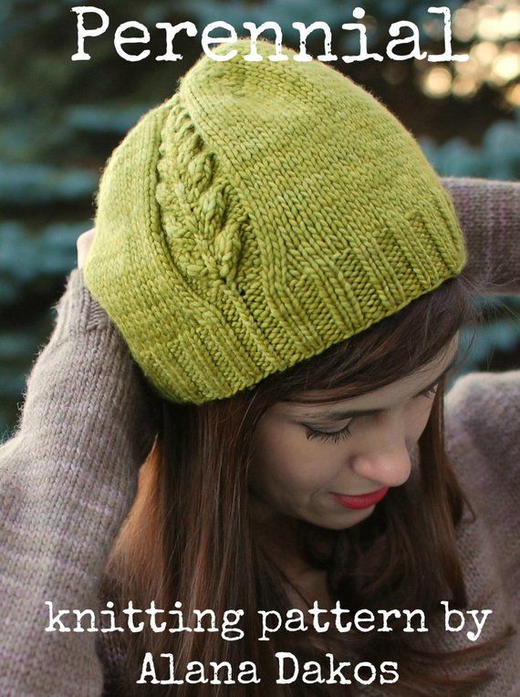 a woman wearing a green knitted hat