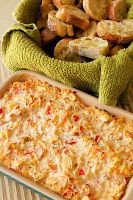 a casserole dish with bread and vegetables in it