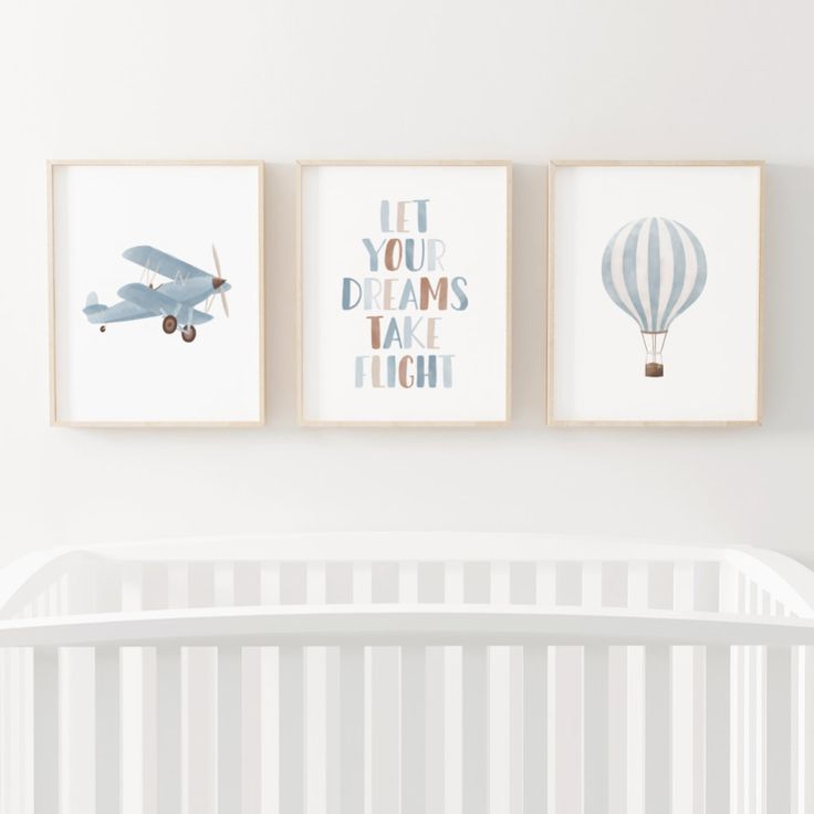 there are three framed pictures on the wall above a crib in this baby's room