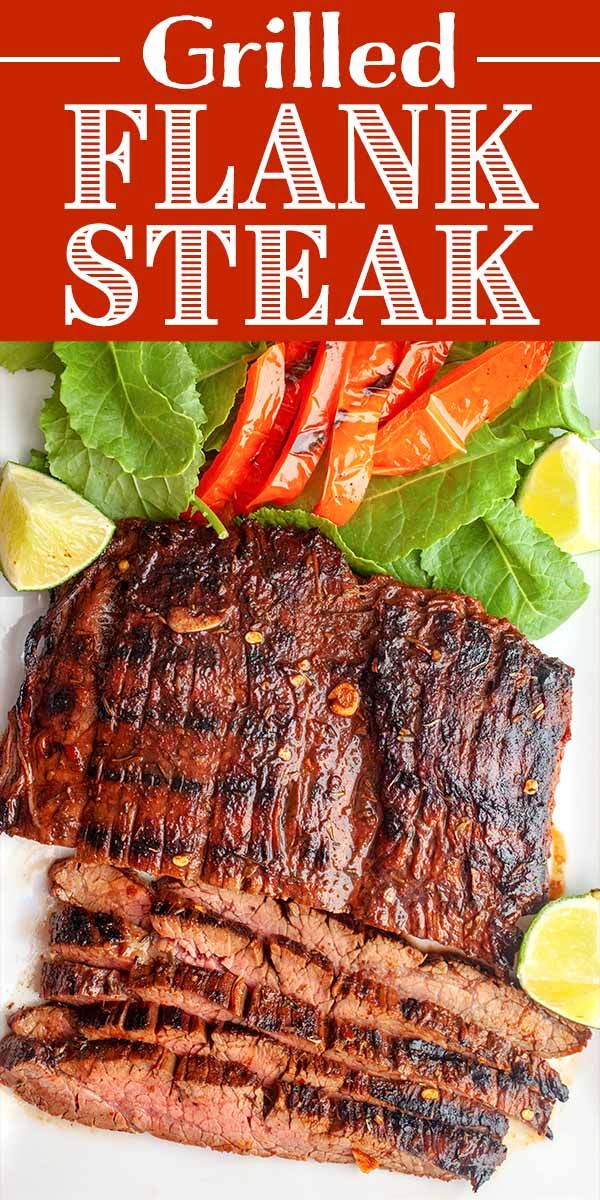 grilled flank steak on a plate with lettuce and peppers