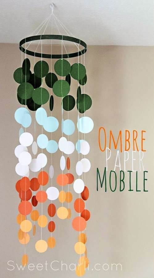 a mobile made out of paper circles with the words ombre pare mobile above it