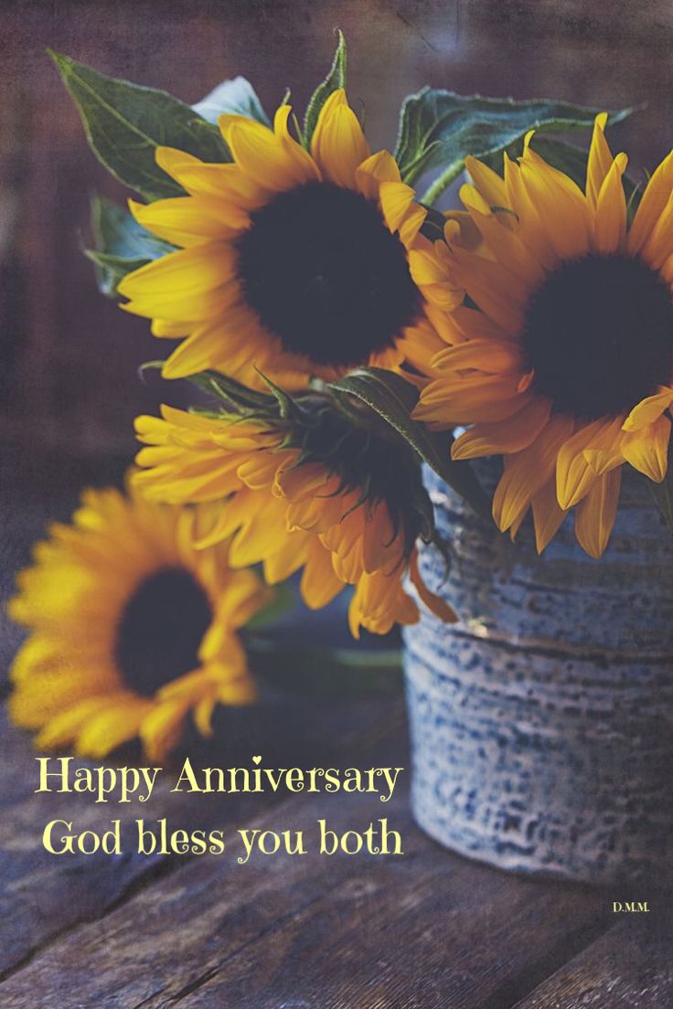 two sunflowers in a vase with the words happy anniversary god bless you both