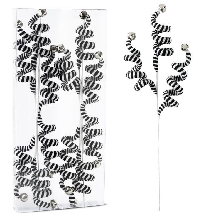 two glass vases with black and white designs on them, one is hanging from the wall