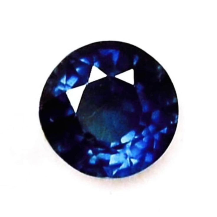 a blue sapphire stone on a white background