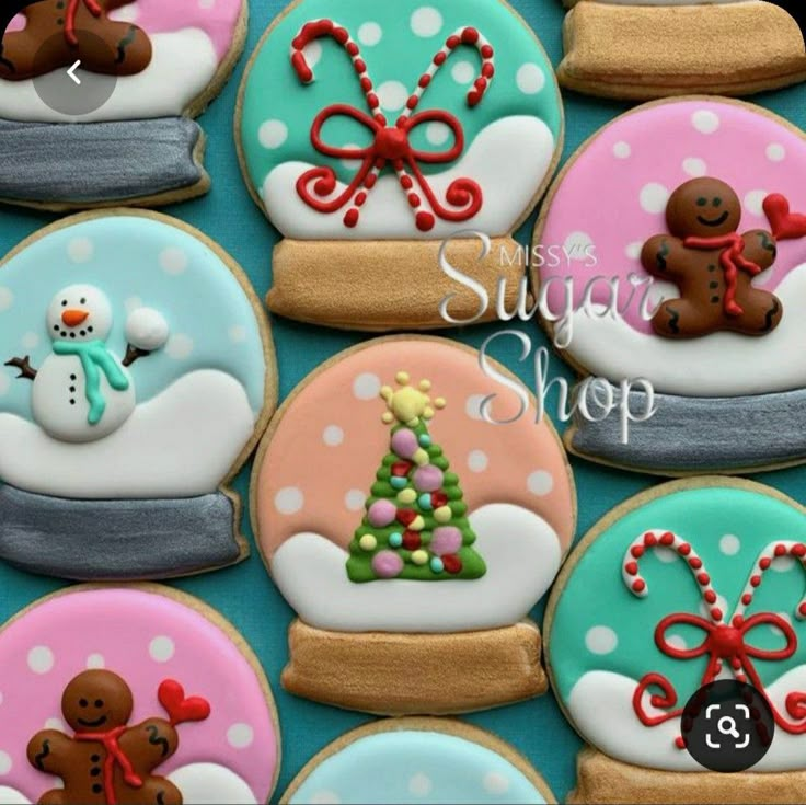 decorated cookies are arranged in the shape of snow globes