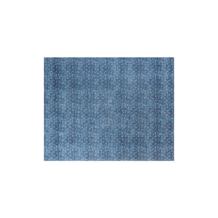 a blue rug with small white dots on it