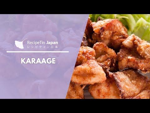 chicken wings and lettuce on a plate with the words karaage written in japanese