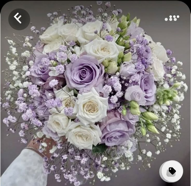 a bridal bouquet with purple and white flowers