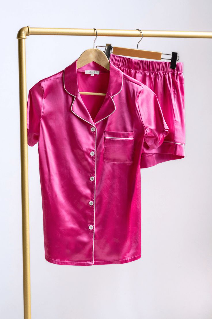 The lustrous hot pink Margo Human Pajama Set adds a touch of glamour to your bedtime routine, making you feel like royalty even when you're winding down for the night. The fabric's gentle caress against your skin will provide unrivalled comfort, ensuring a peaceful and restful sleep. Details Fabric: Polyester, SpandexDesign: Hot pink silky pajama shirt & short setSizing: True to size with a stretch Hot Pink Pajamas, Pink Satin Sleepwear For Lounging, Pink Satin Sleepwear For Bedtime, Pink Fitted Loungewear Set, Pink Satin Sleepwear For Nightwear, Neon Pajamas, Pink Summer Night Sets, Pink Satin Loungewear Sets, Pink Satin Pajama Party Sets