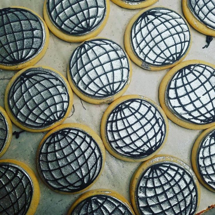 some cookies with black and white designs on them