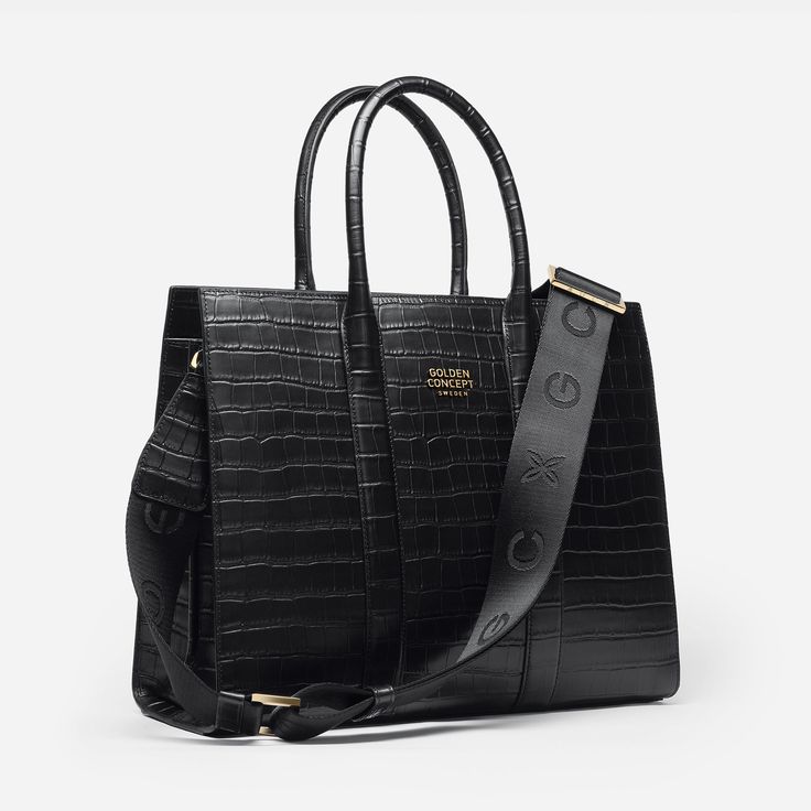 Experience the perfect blend of elegance and practicality with our Tote Bag. Crafted from exquisite Croco Embossed leather, it features the iconic GC logo on the front. With a spacious main compartment, convenient zipped pocket, your essentials stay secure. The folding leather handles offer versatile carrying options – by hand or shoulder. Elevate your daily style with this embodiment of functional luxury. SIZE W 37 x H 32 x D 14 cm Luxury Business Bags With Top Carry Handle, Luxury Shoulder Laptop Bag With Top Carry Handle, Luxury Office Tote Bag, Luxury Office Crossbody Bag, Luxury Large Capacity Satchel For Daily Use, Luxury Satchel Laptop Bag With Top Carry Handle, Luxury Briefcase With Large Capacity And Top Handle, Luxury Large Capacity Top Handle Briefcase, Luxury Business Bag With Removable Pouch