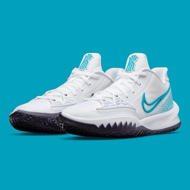 the nike zoom basketball shoe is white with blue accents on the upper part of the shoe