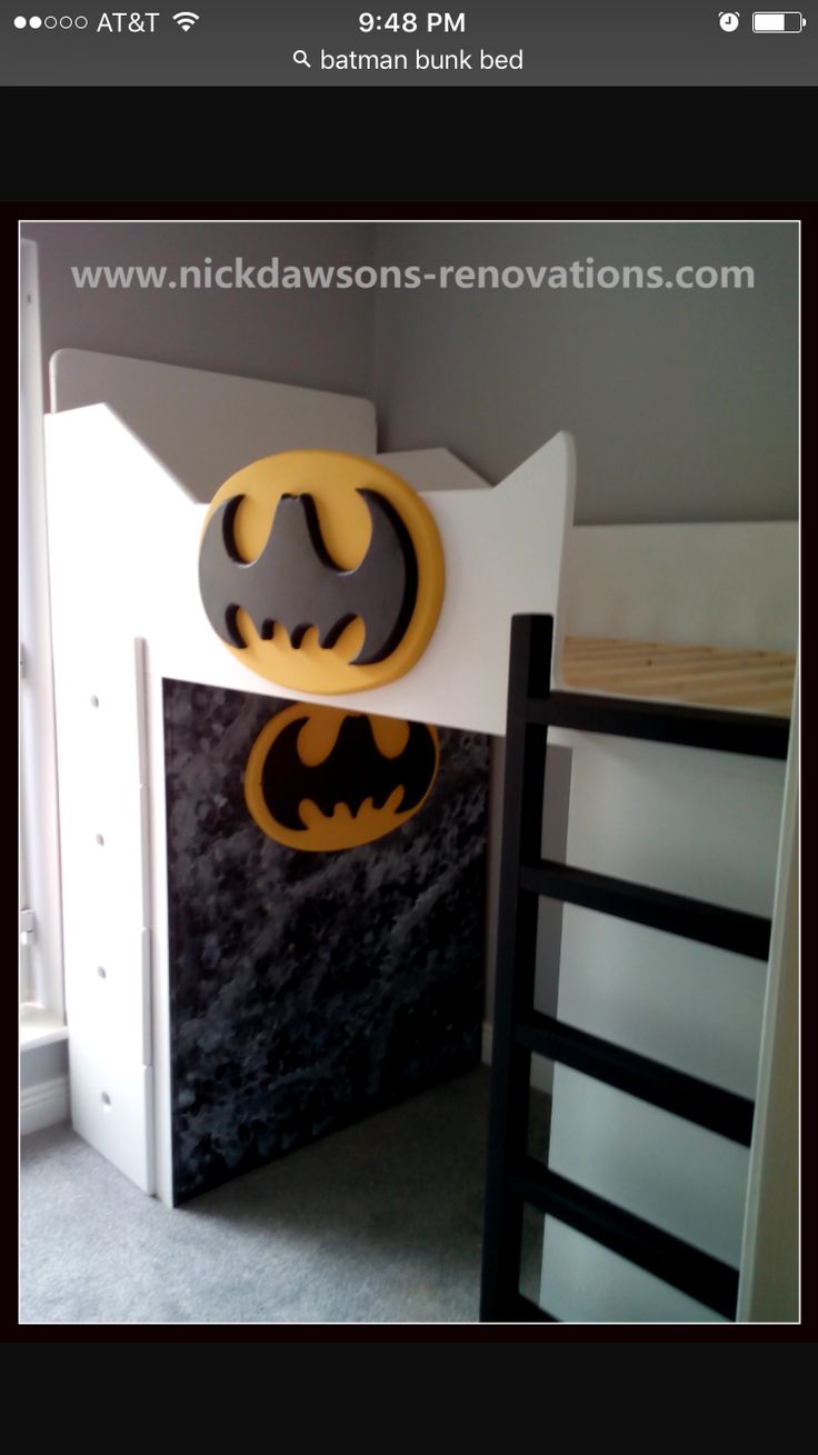 a batman themed bunk bed in a child's room