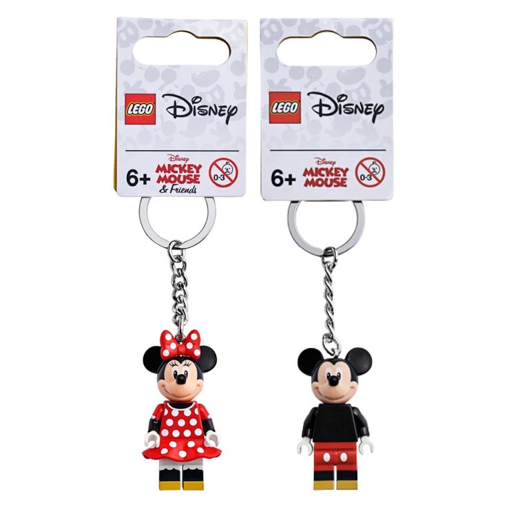 two key chains with mickey mouse and minnie mouse in red outfits on them, one has a