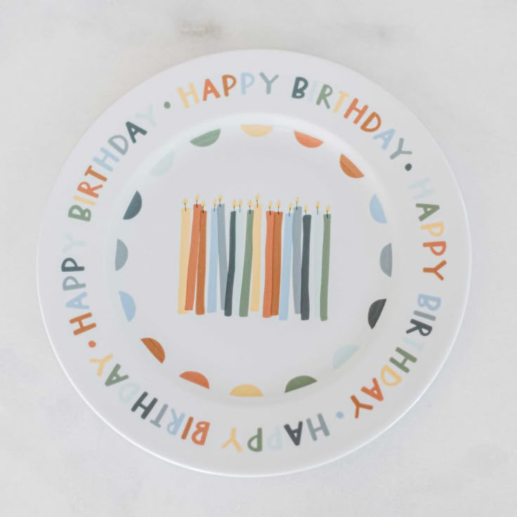 a birthday plate with candles on it that says happy birthday