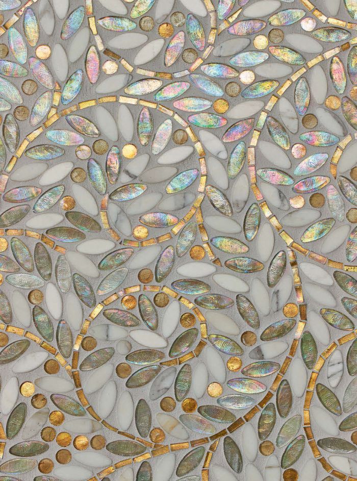 a decorative glass panel with gold and silver leaves